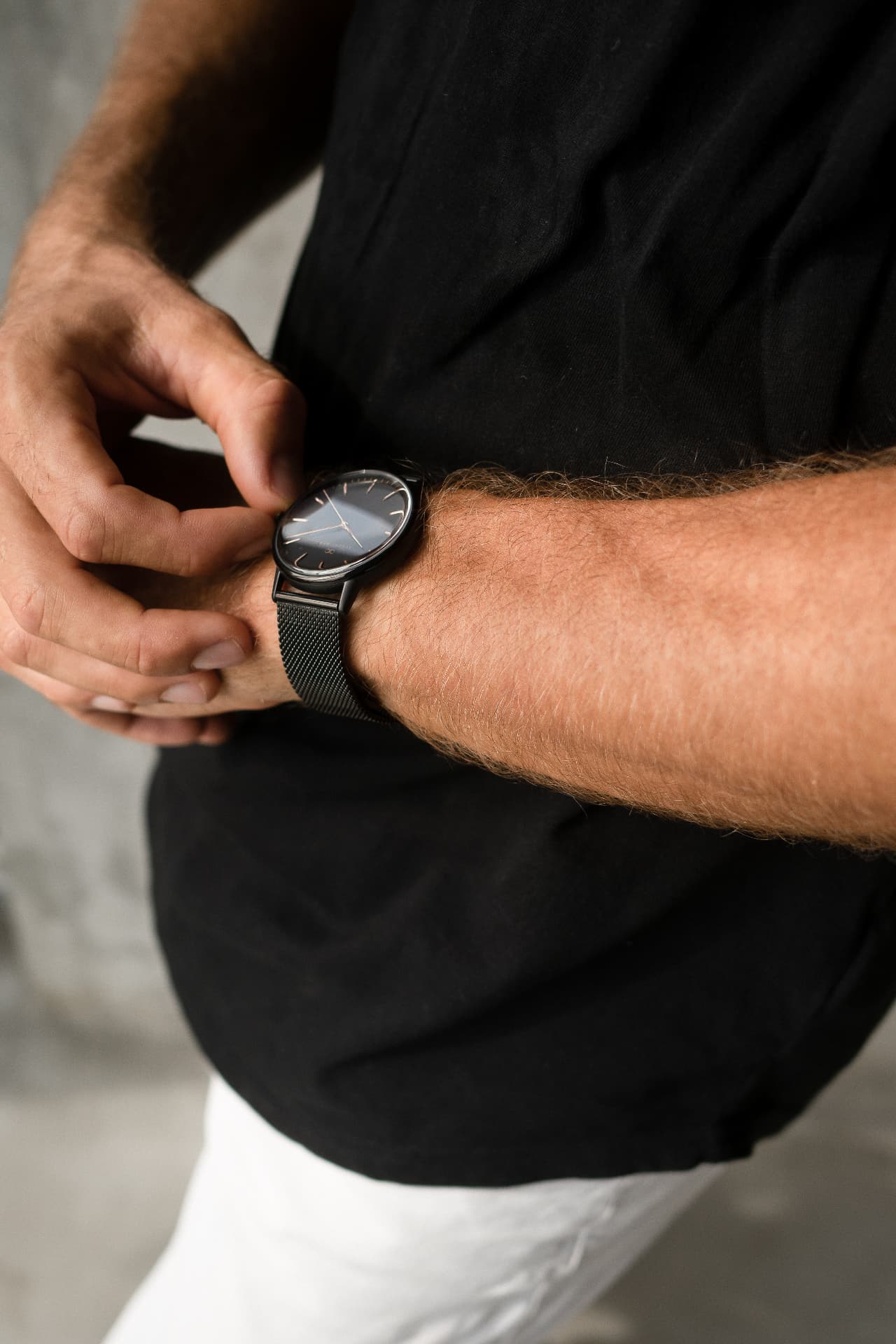 The Considered Wearer wearing a black August Berg watch