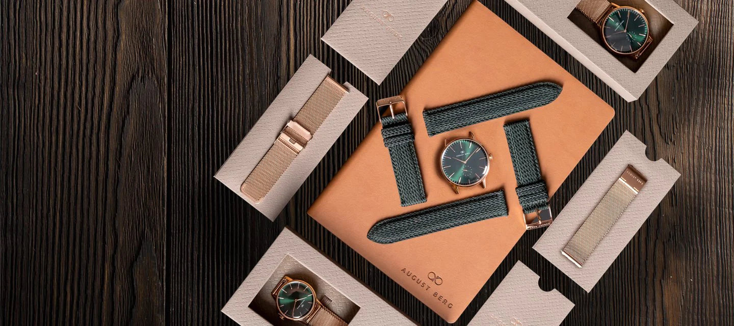 August Berg gift set for him with a watch, extra straps and gift boxes on a wooden table
